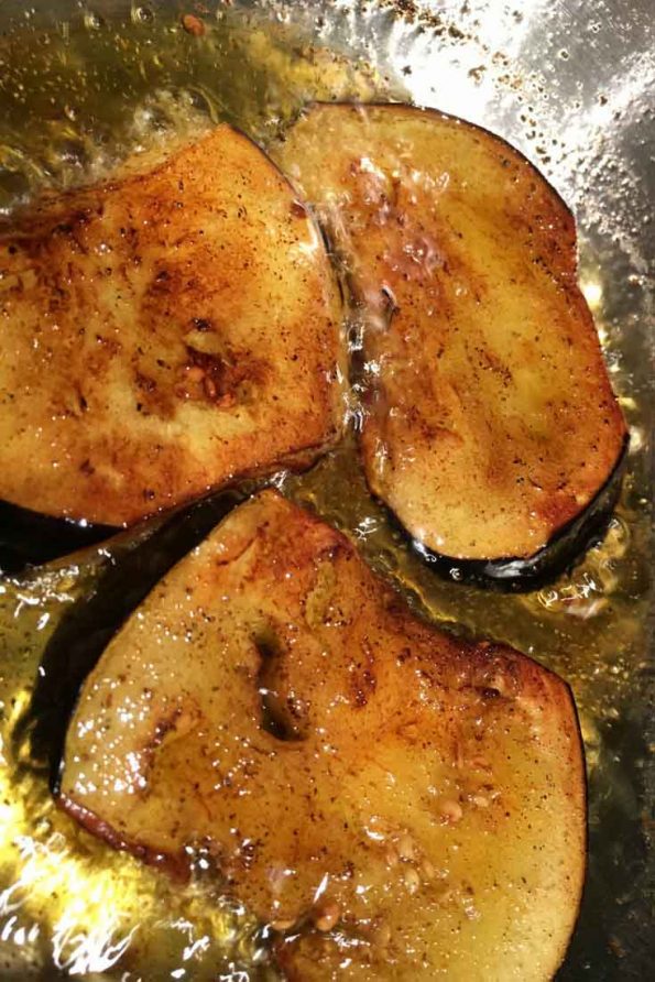 frying eggplant slices in oil