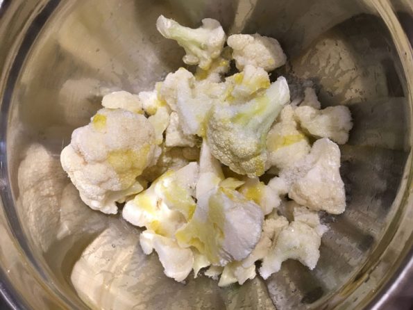 drizzle olive oil in cauliflower