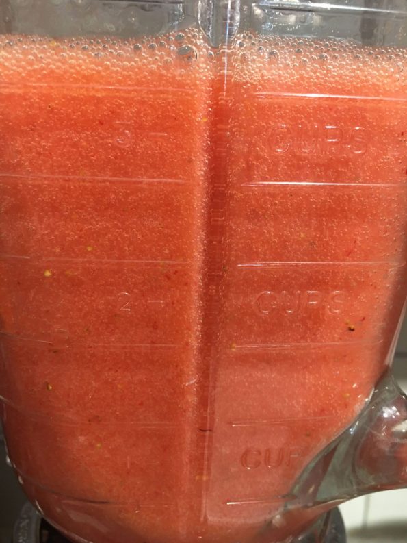 making strawberry juice in blender