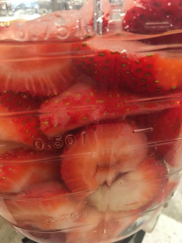 making strawberry juice in blender