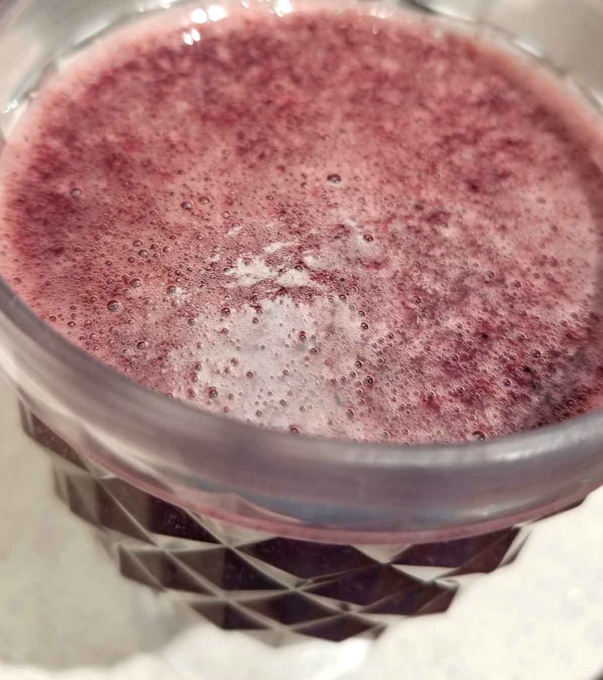 blueberry juice served in cup