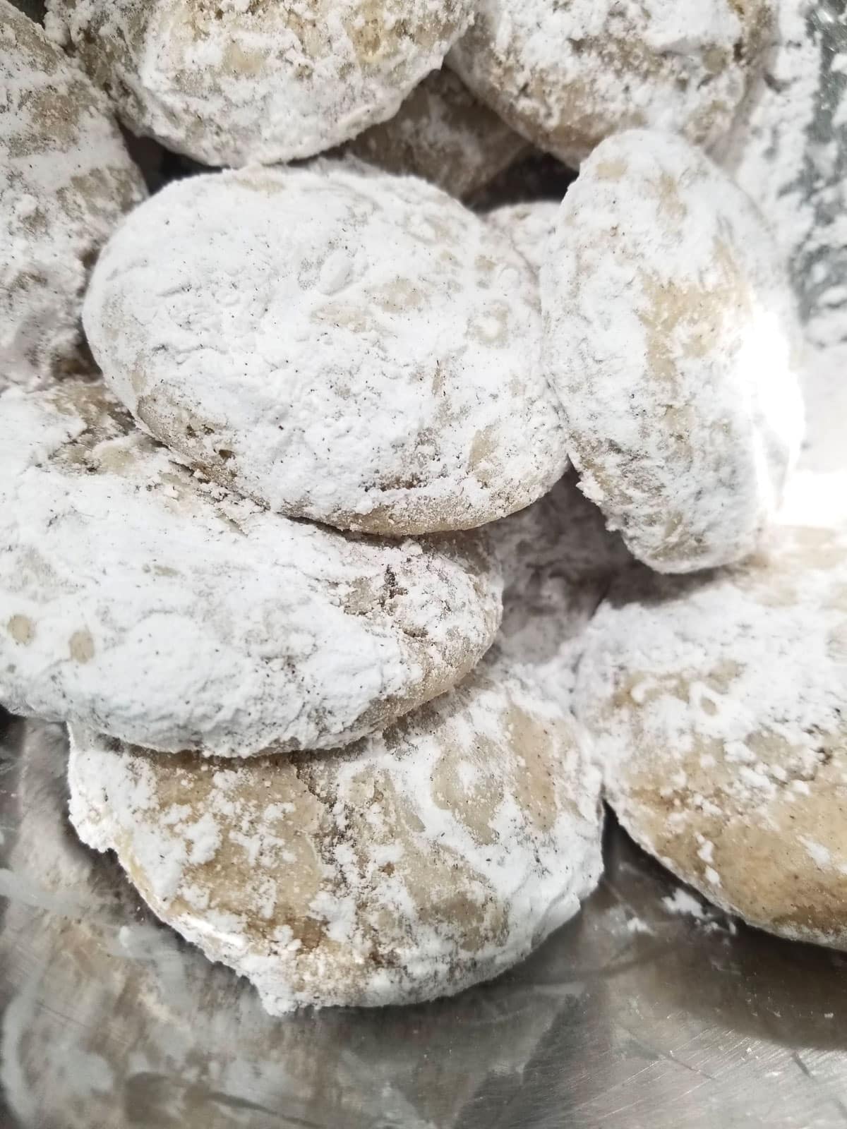 sugar cookies in cinnamon sugar mix