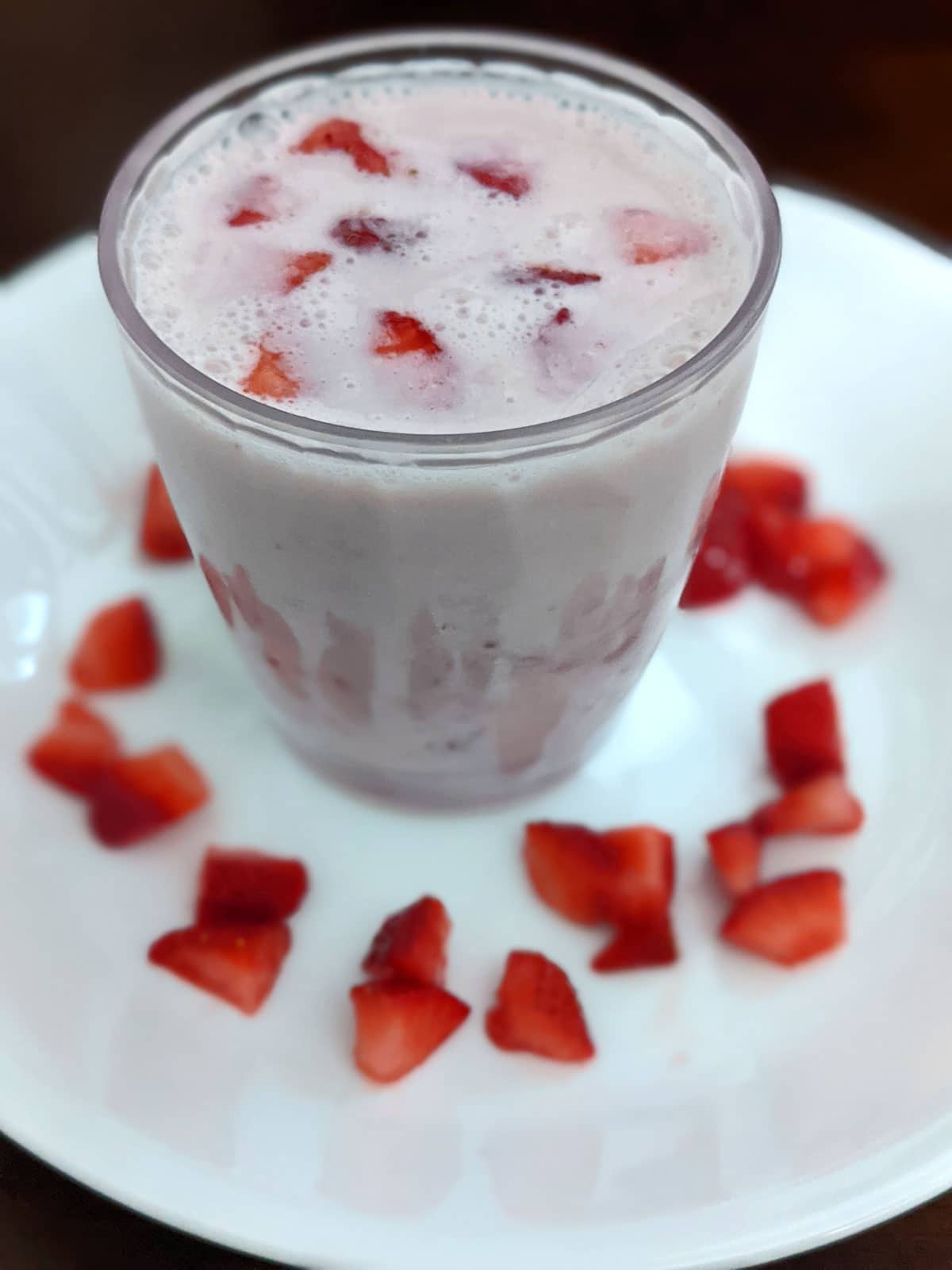 strawberry milk with homemade strawberry syrup and fresh strawberries