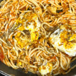 fried spaghetti with fried eggs