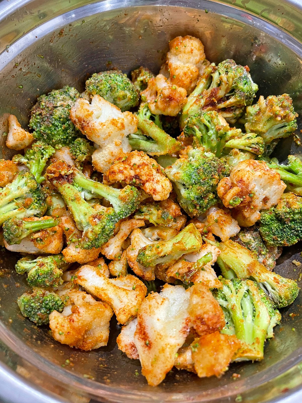 broccoli and cauliflower mixed with spices, balsamic vinegar and oil