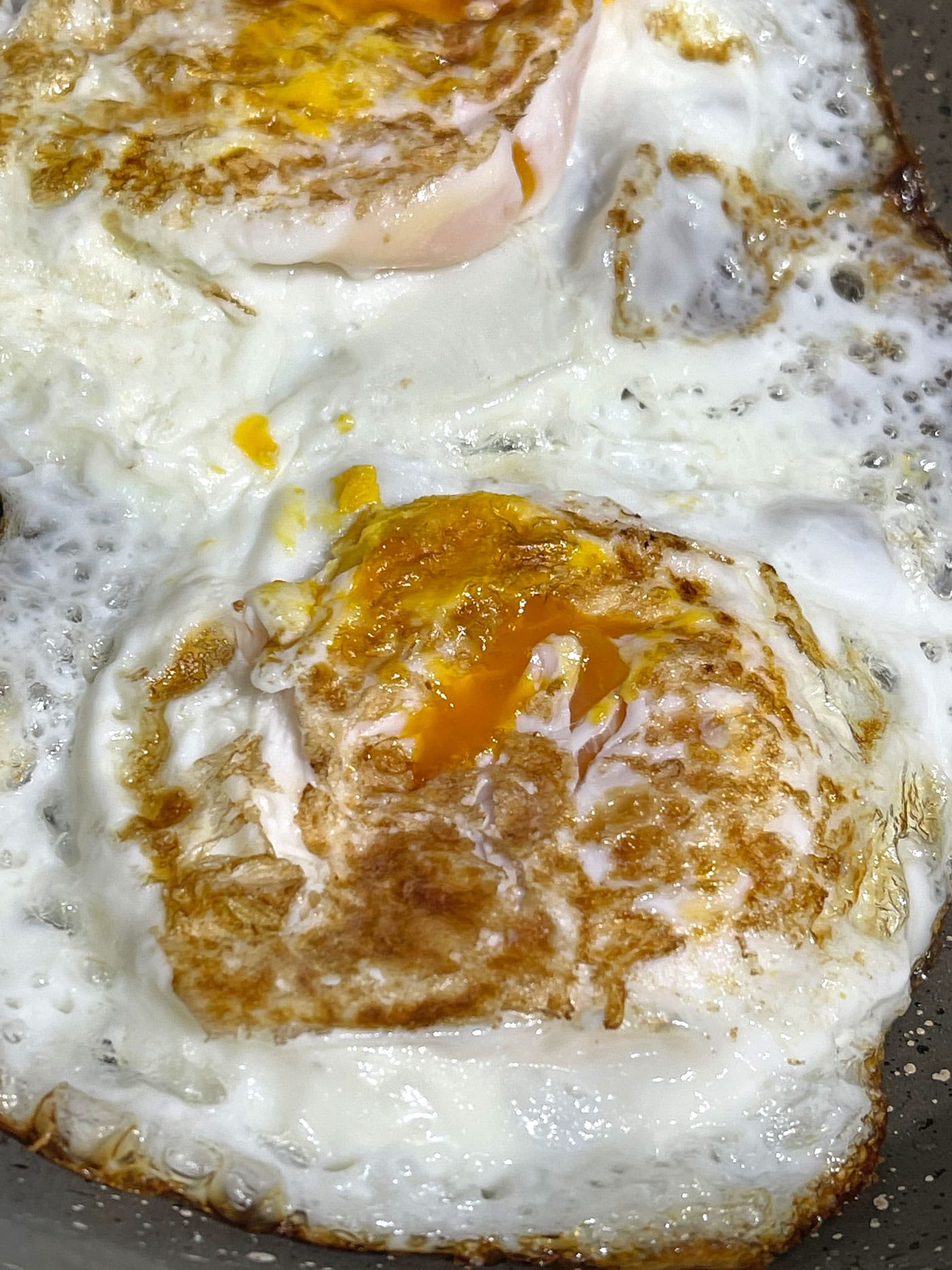 fried eggs flipped