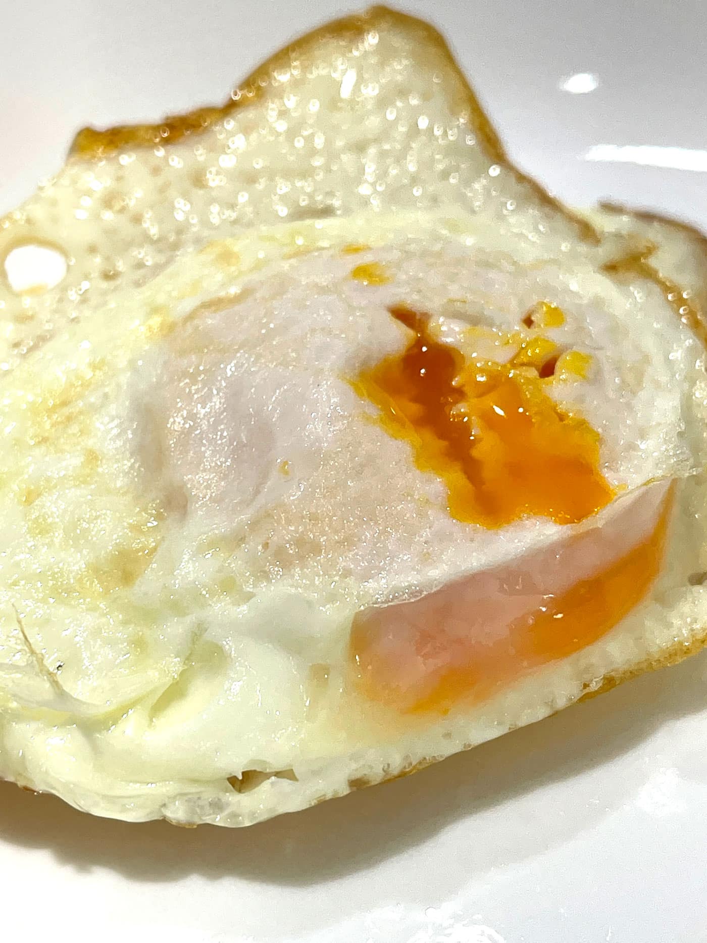 fried eggs over medium yolks
