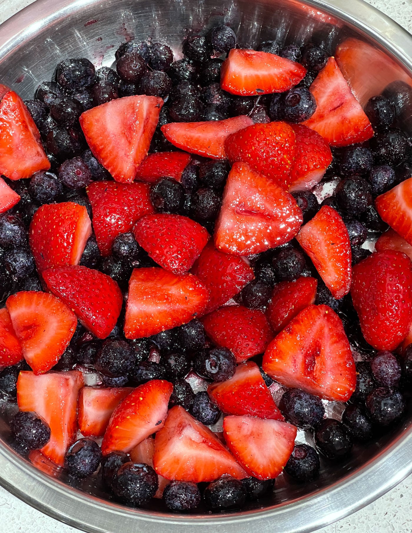 berries arranged in a single layer in the baking pan