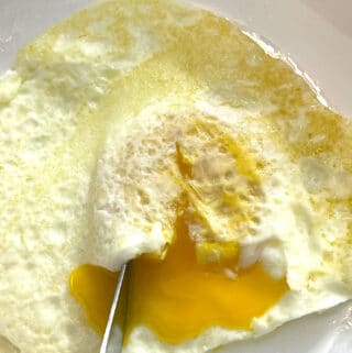over easy fried eggs with runny yolks