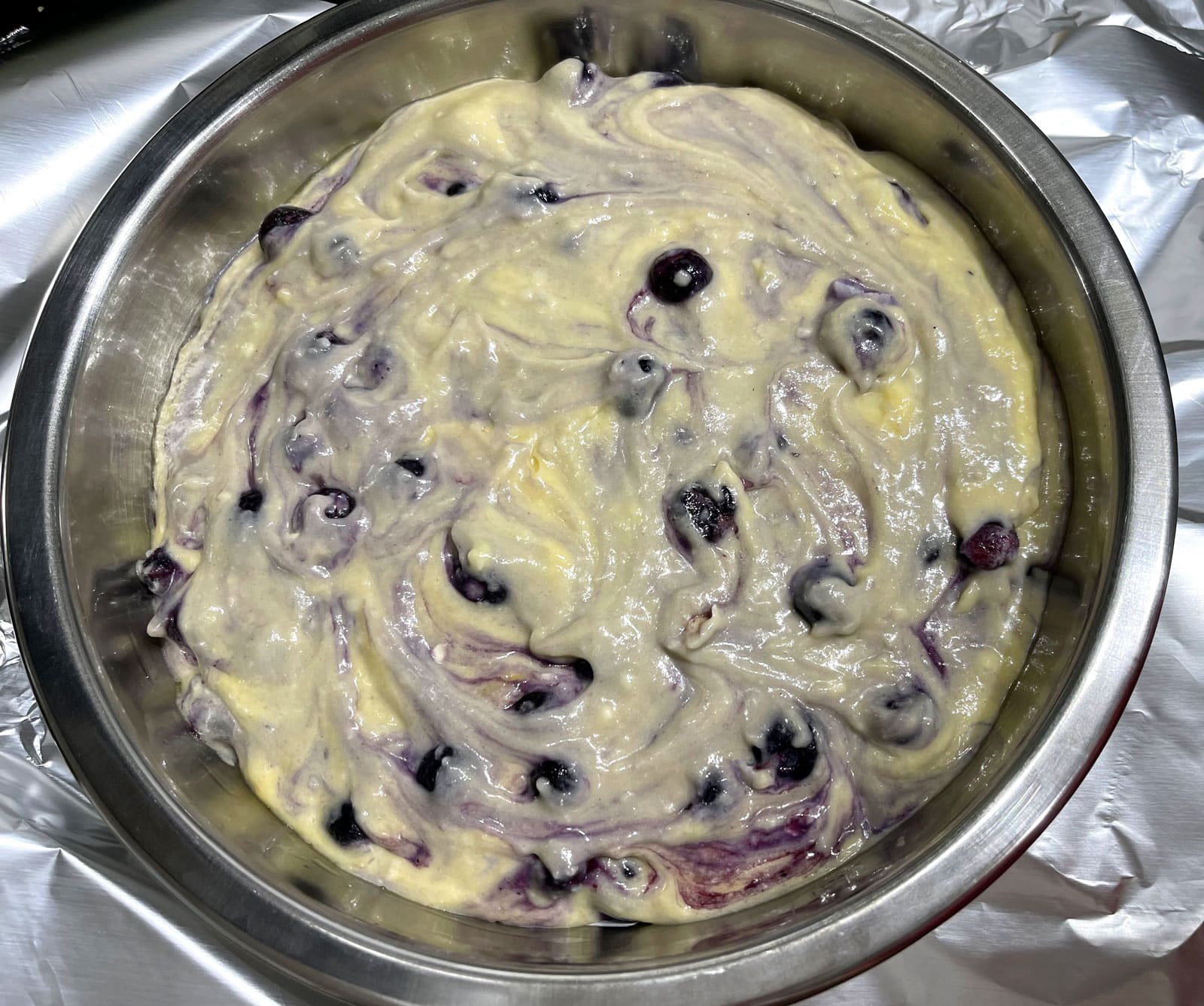 blueberry cake batter in cake pan