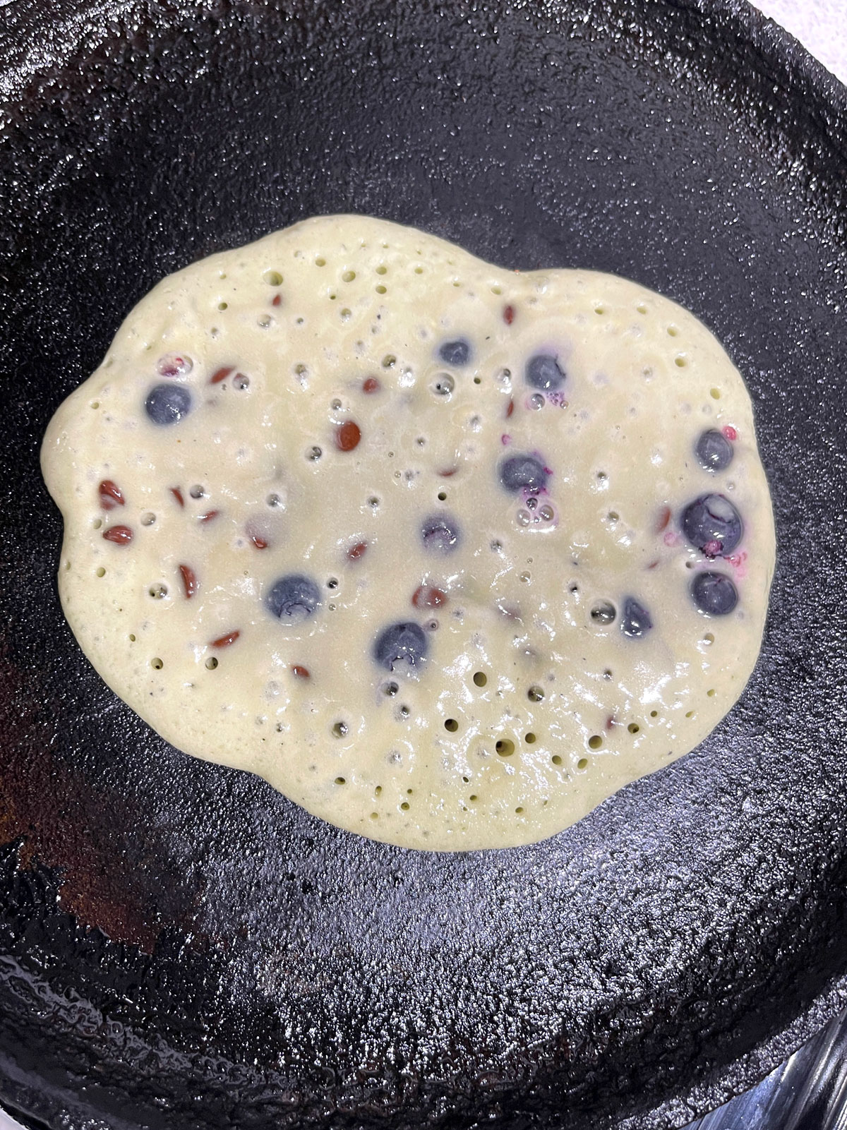 making blueberry chocolate chip pancake