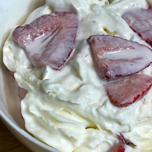 strawberries and cream with whipped cream topping