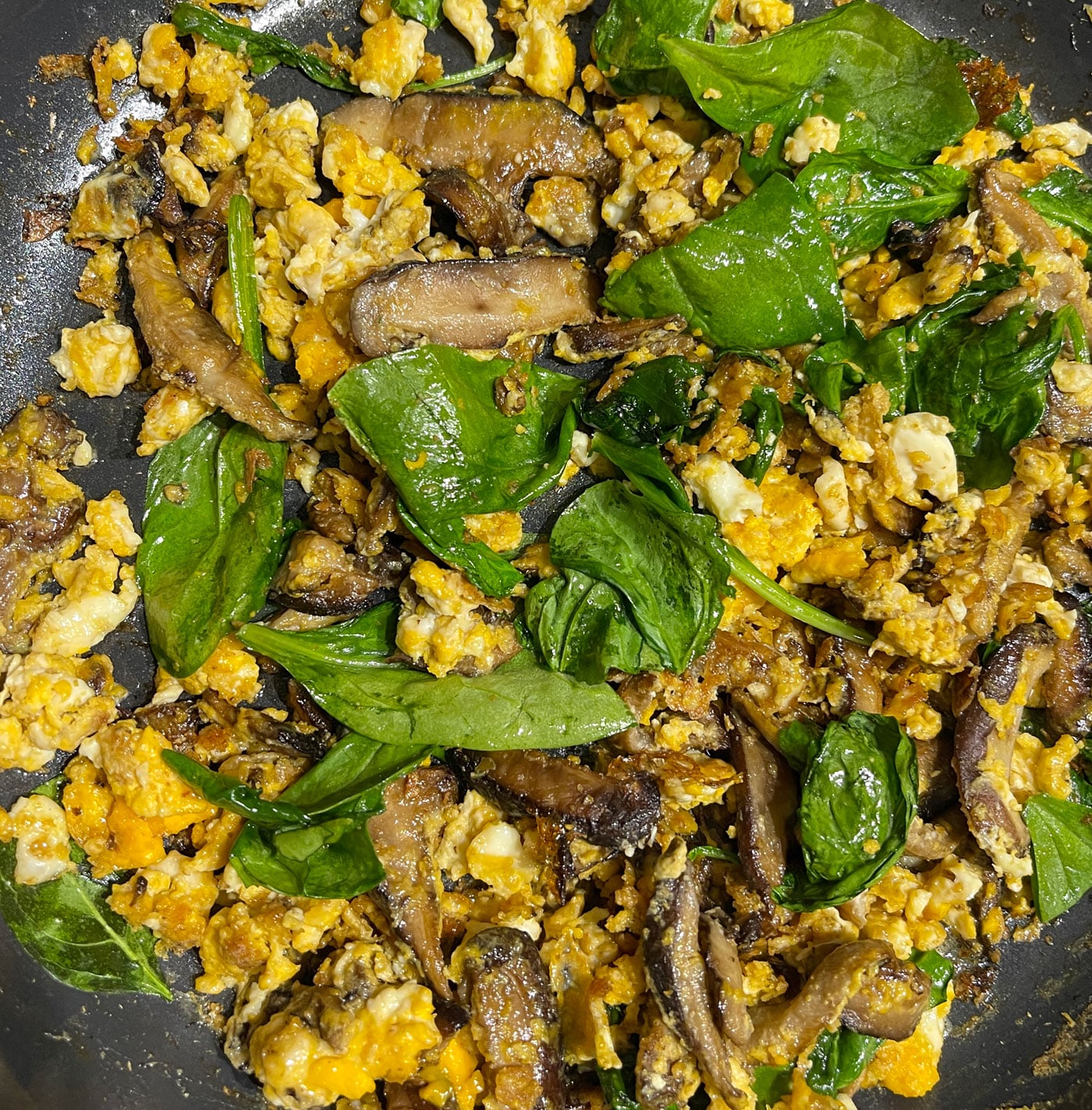 mushrooms and eggs with spinach leaves