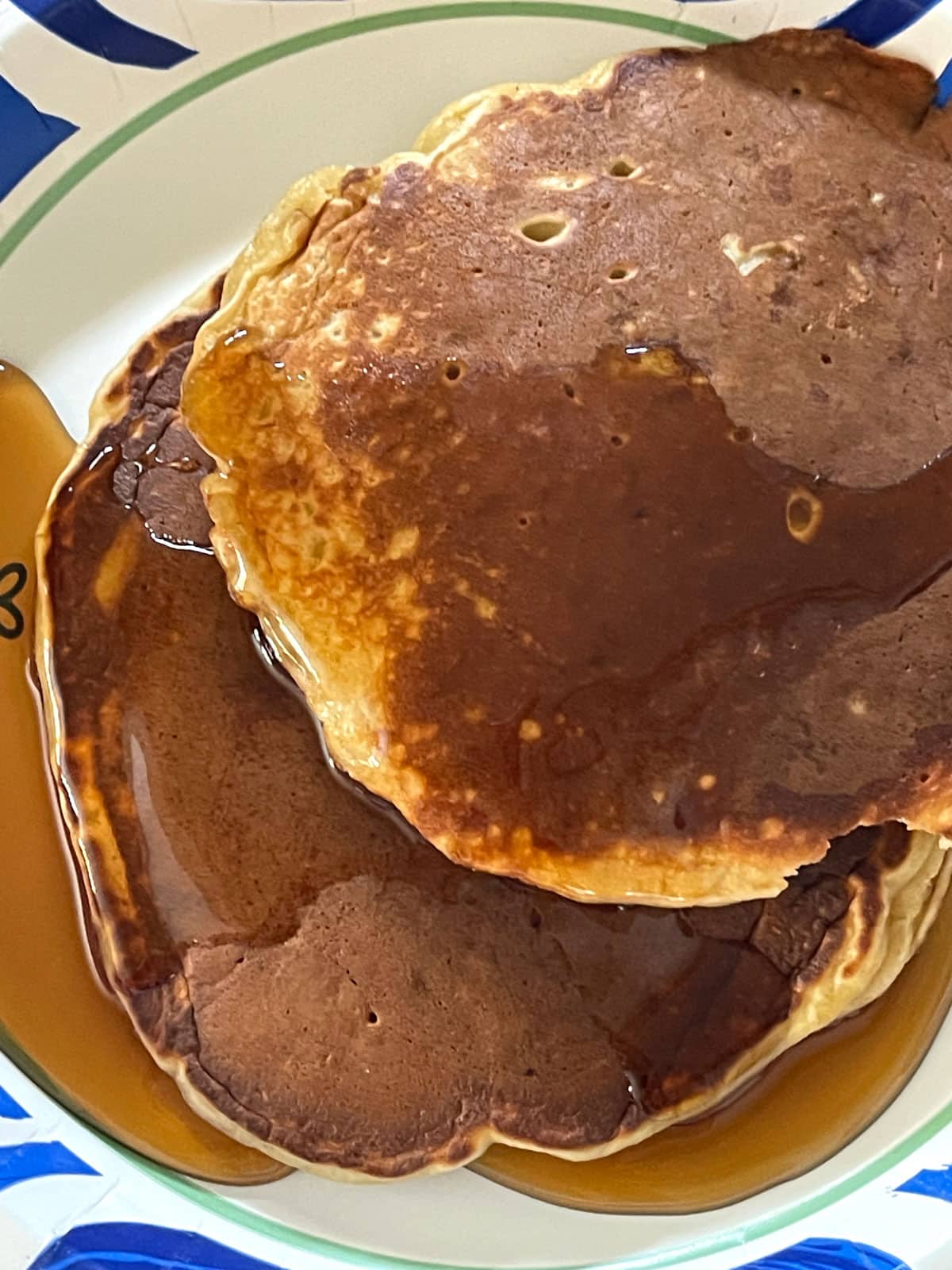 pancakes with peanut butter and bananas served with maple syrup