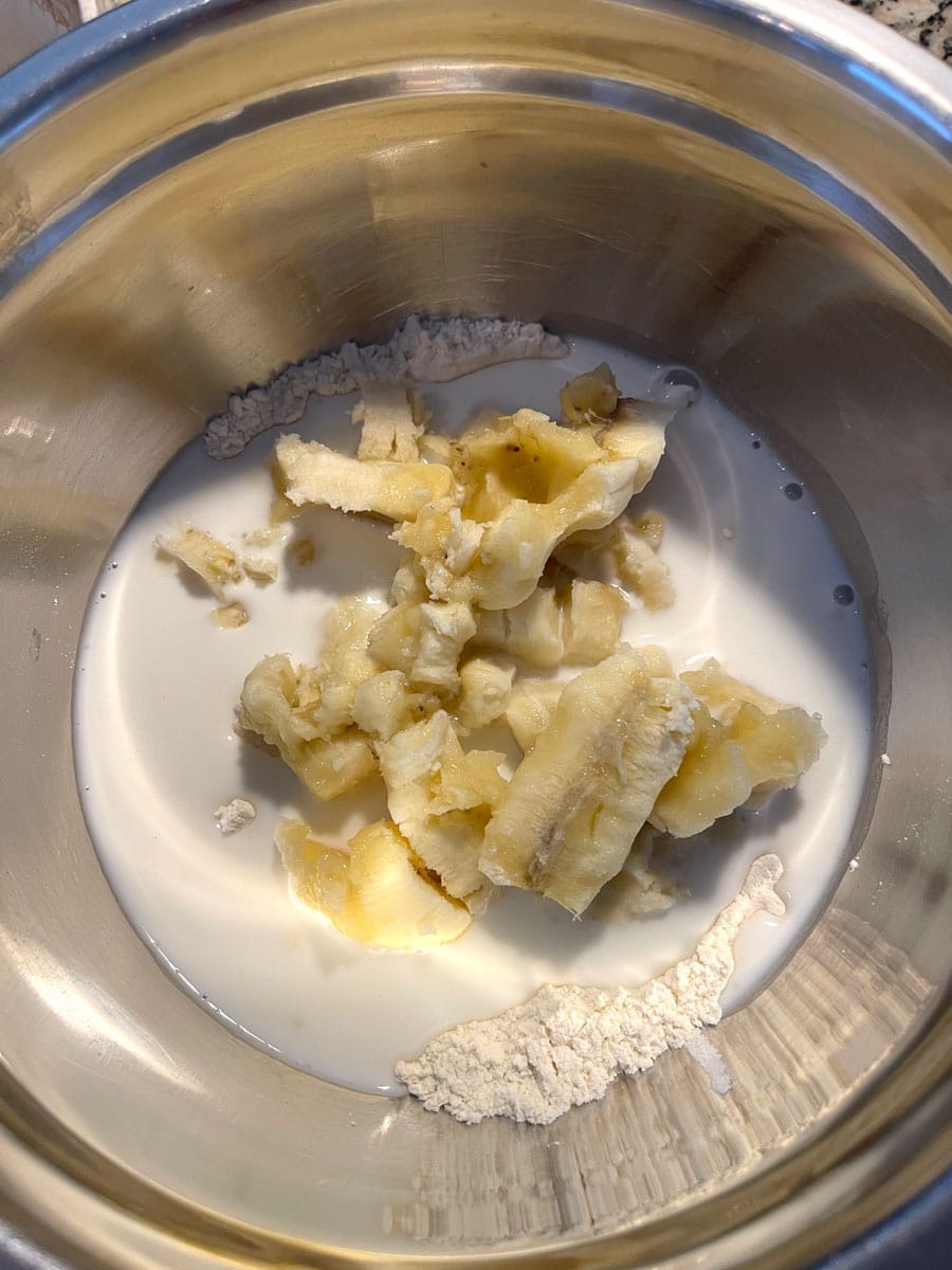 bananas, flour and milk in bowl