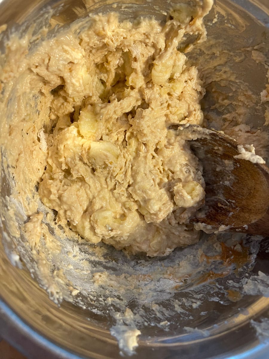 add peanut butter to bananas and flour and mix