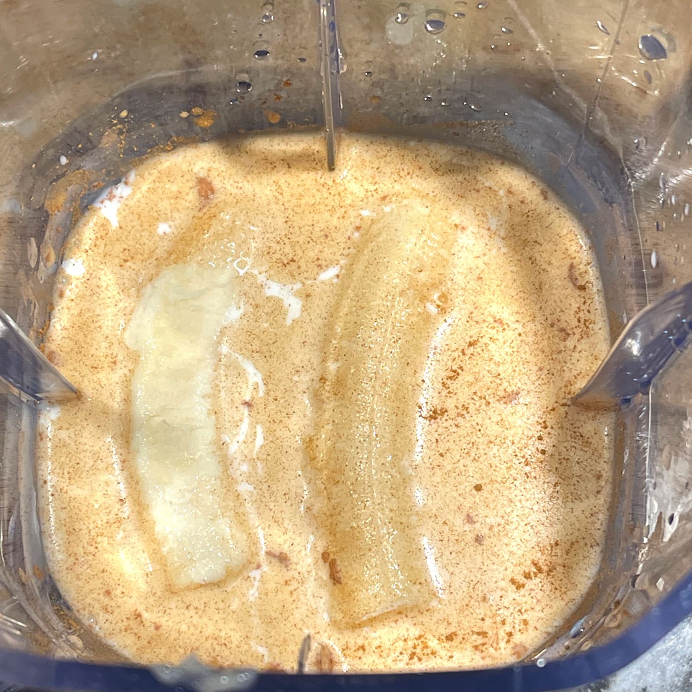 making banana vanilla cinnamon milk in blender